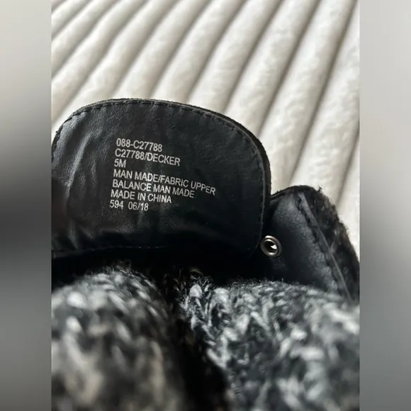 Cliffs by white mountain women black boots