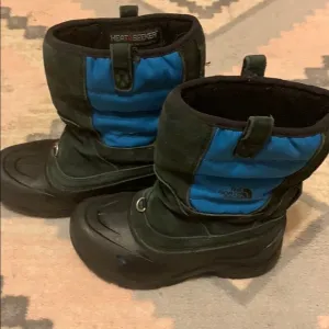 The North Face snow boots.