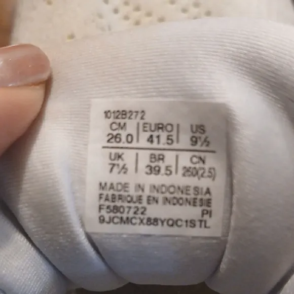 White and Yellow Athletic Shoes