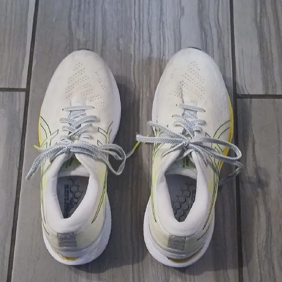 White and Yellow Athletic Shoes